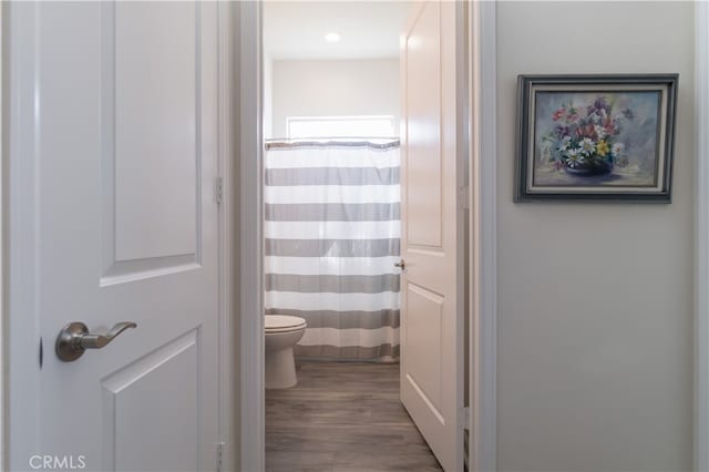 11121 Fourleaf Ct, Corona, CA 92883 - full bathroom with wood finished floors and curtained shower