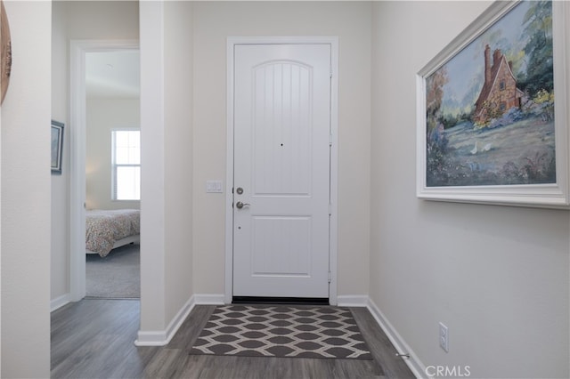 11121 Fourleaf Ct, Corona, CA 92883 - entrance foyer featuring dark wood-type flooring and baseboards