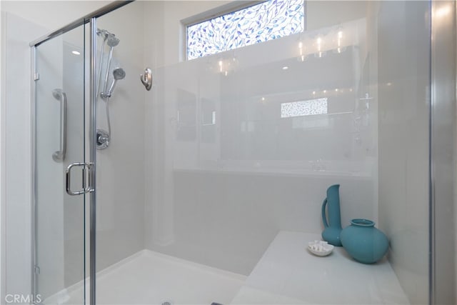 bathroom featuring an enclosed shower