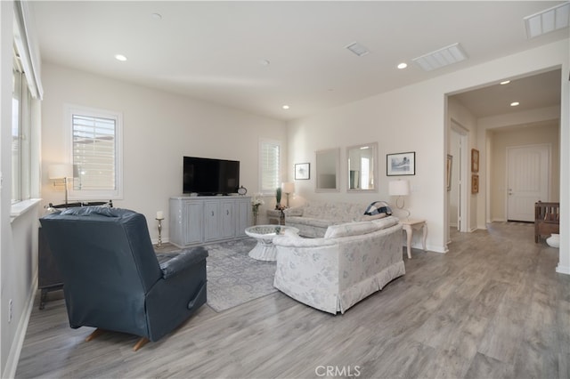 11121 Fourleaf Ct, Corona, CA 92883 - living area featuring light wood finished floors and recessed lighting