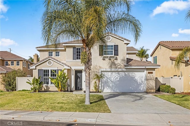 mediterranean / spanish house featuring a garage and a front lawn