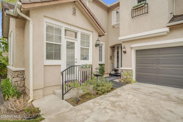 entrance to property featuring a garage