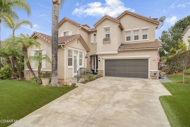 view of front facade featuring a garage and a front lawn