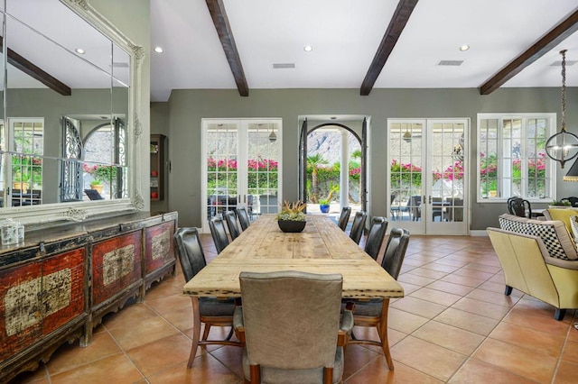 dining room with a healthy amount of sunlight, french doors, and beamed ceiling