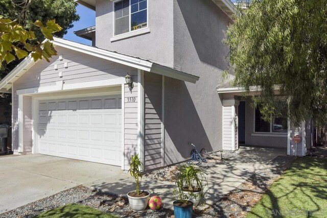 view of side of property with a garage