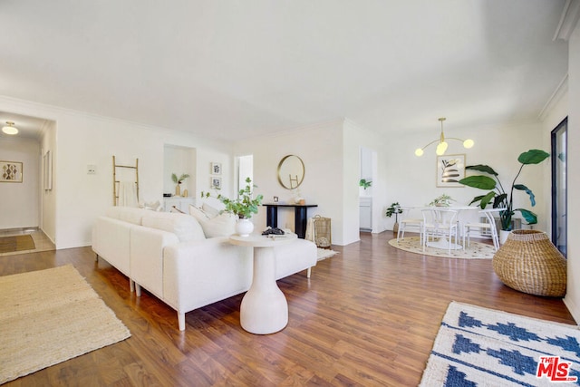 living room with dark hardwood / wood-style flooring and crown molding