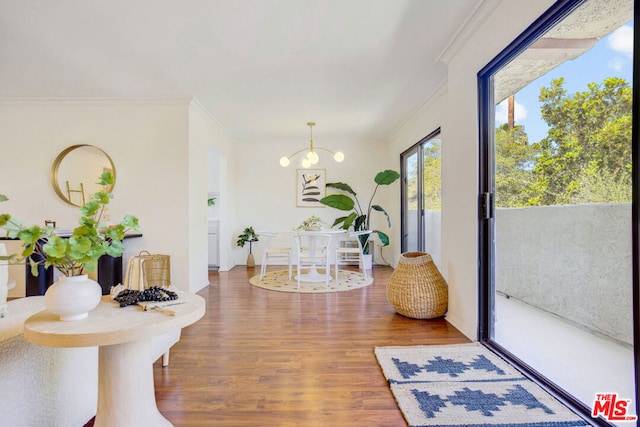 dining room featuring ornamental molding and hardwood / wood-style flooring