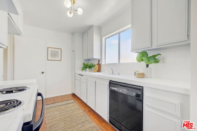 kitchen featuring black dishwasher, backsplash, white cabinets, light hardwood / wood-style flooring, and sink