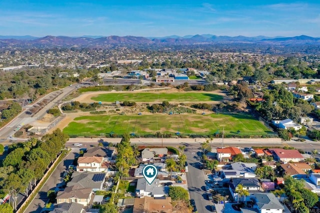 birds eye view of property with a mountain view