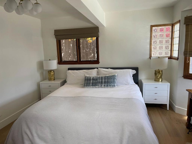 bedroom with wood-type flooring