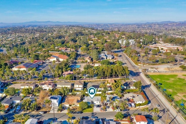 birds eye view of property with a mountain view