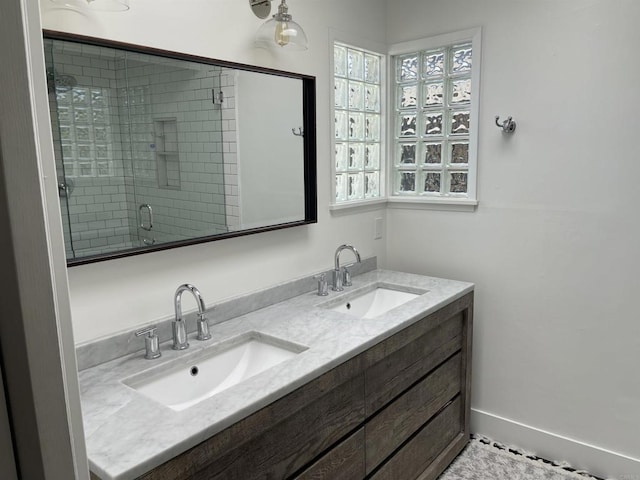 bathroom featuring vanity and a shower with door