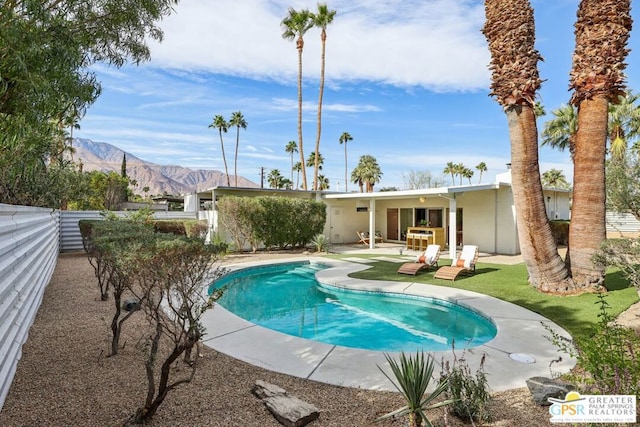 view of pool featuring a patio area and a mountain view