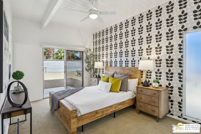 bedroom featuring ceiling fan, light colored carpet, beam ceiling, and access to outside