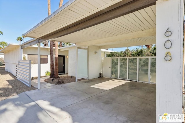 view of patio / terrace with a carport