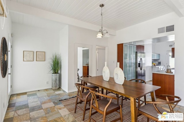 dining space featuring wooden ceiling, beamed ceiling, and an inviting chandelier