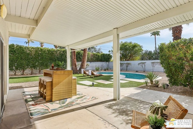 view of patio with a fenced in pool