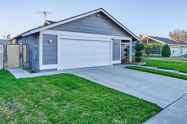 ranch-style home with a front yard and a garage