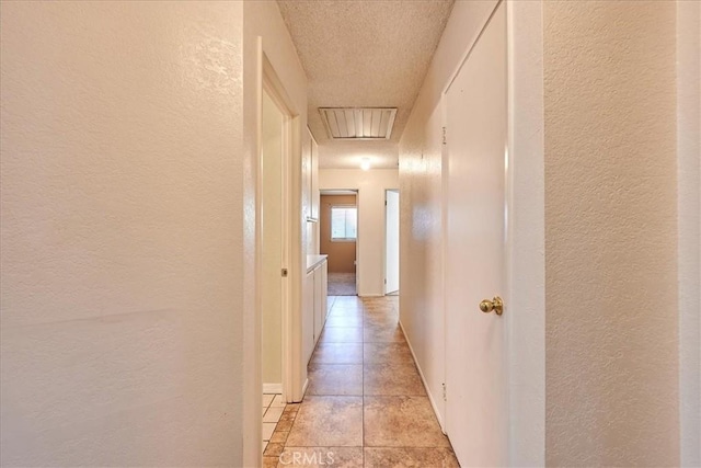 hall with light tile patterned flooring