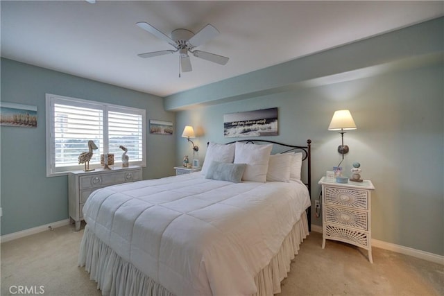 bedroom with ceiling fan and light colored carpet