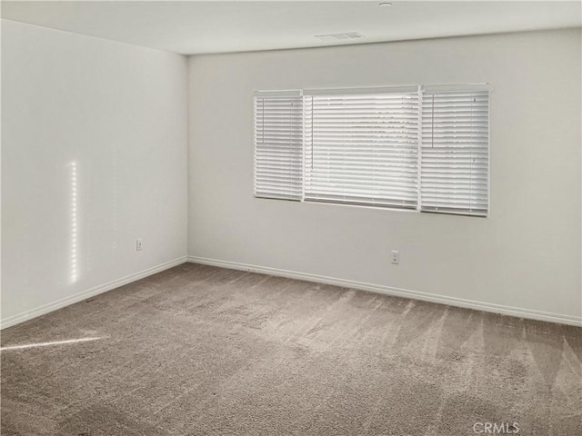 empty room featuring carpet floors