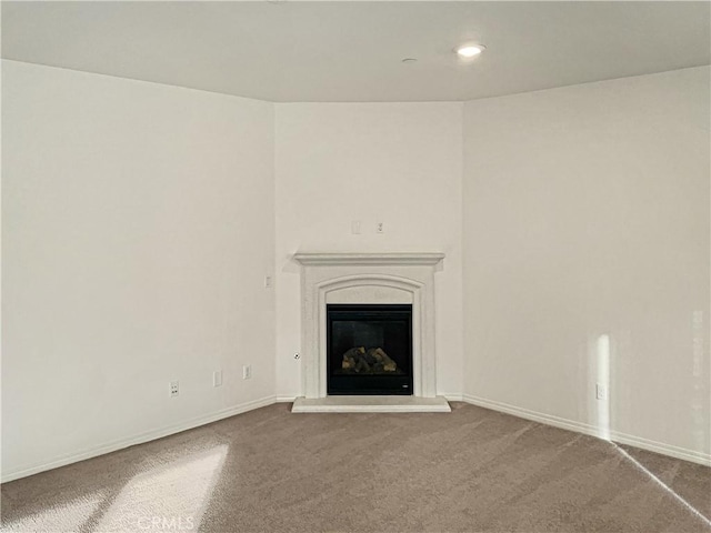 unfurnished living room with carpet