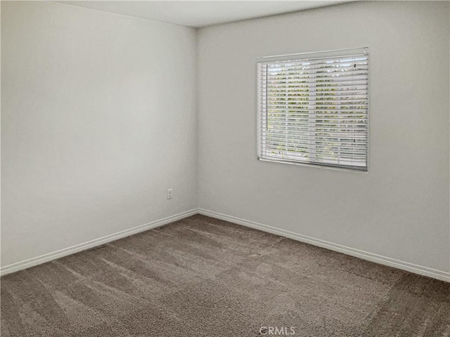 empty room featuring carpet flooring