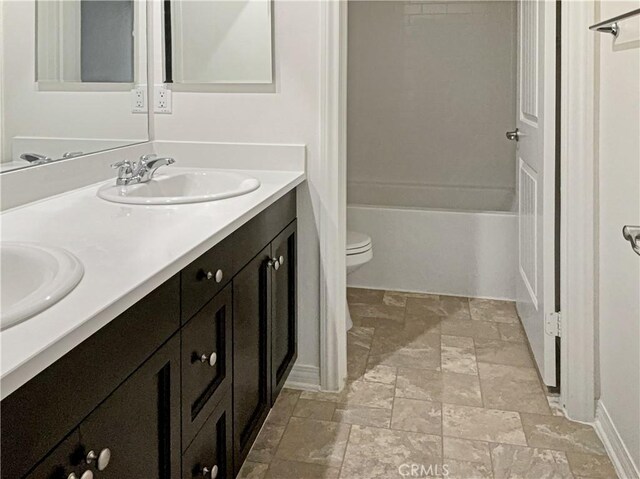 full bathroom featuring vanity, toilet, and shower / bathing tub combination