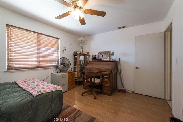 bedroom featuring ceiling fan and light hardwood / wood-style floors