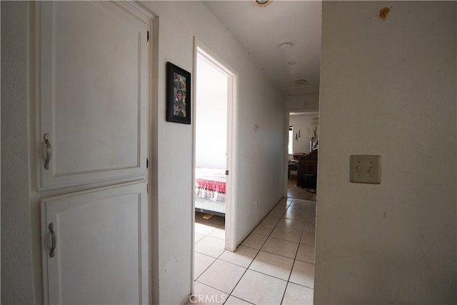 hallway with light tile patterned floors