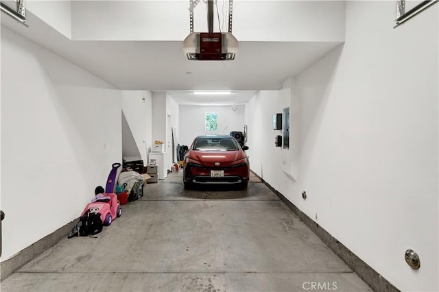 garage featuring a garage door opener