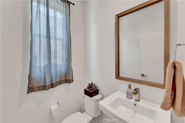 bathroom with sink and toilet