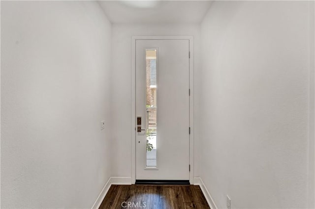 doorway to outside featuring dark hardwood / wood-style flooring