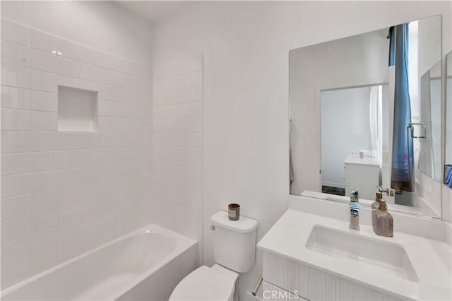 full bathroom featuring toilet, vanity, and bathtub / shower combination