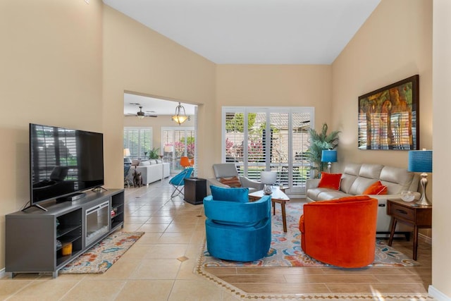 living room featuring ceiling fan and light tile patterned floors