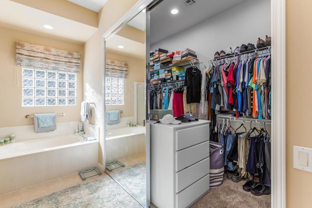 spacious closet featuring light tile patterned floors