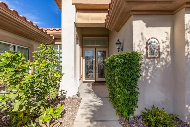 property entrance featuring french doors