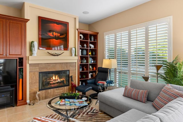 tiled living room featuring a tile fireplace