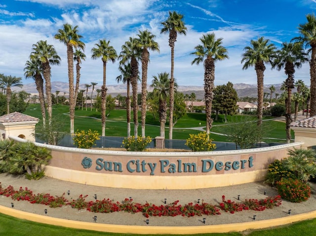 community sign featuring a mountain view