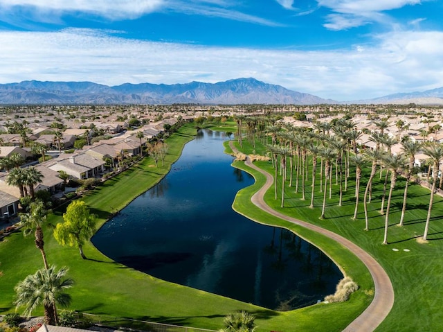 drone / aerial view with a water and mountain view