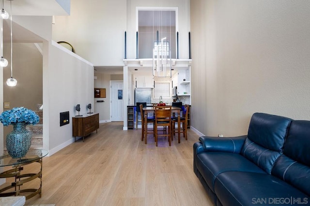 living room with light hardwood / wood-style flooring