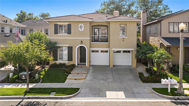 mediterranean / spanish house featuring a garage