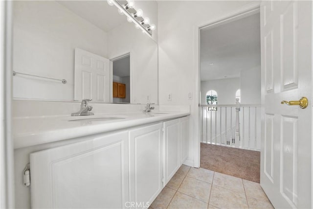 bathroom with tile patterned flooring and vanity