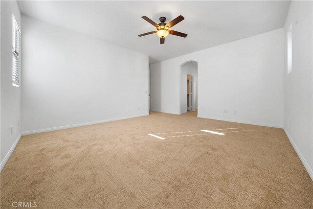 unfurnished room with ceiling fan and carpet floors