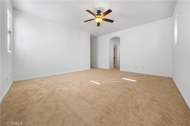 unfurnished room featuring carpet floors and ceiling fan