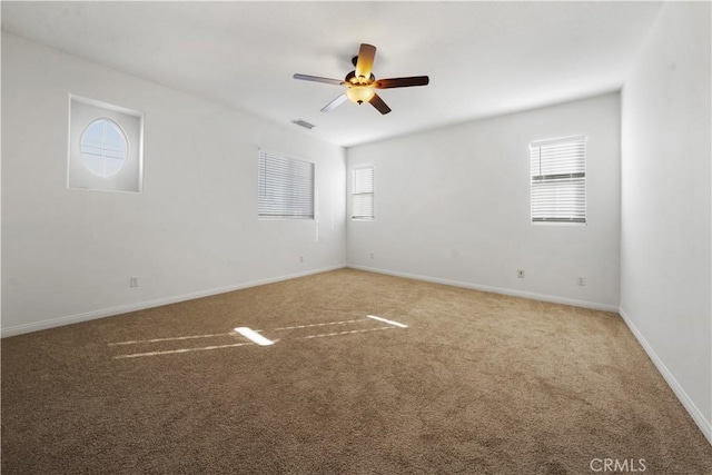 carpeted empty room with ceiling fan