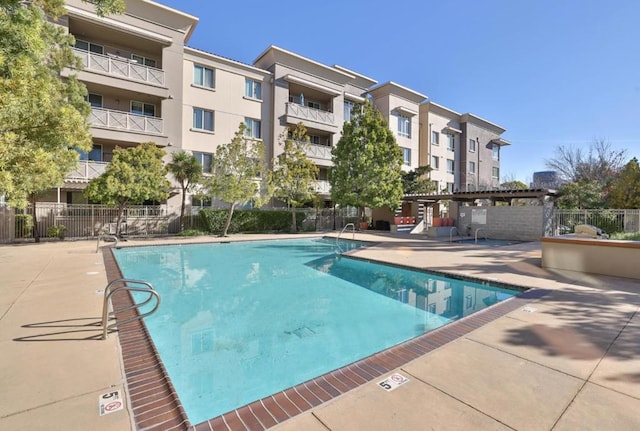 view of pool featuring a patio area