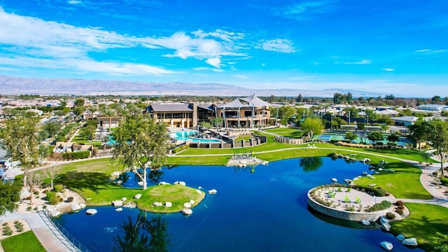 drone / aerial view featuring a water and mountain view