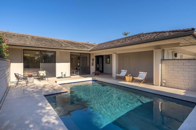 view of pool featuring a patio area