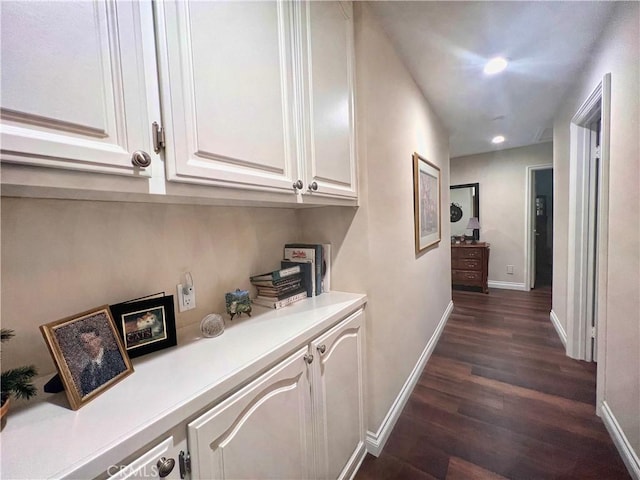 corridor with dark wood-type flooring